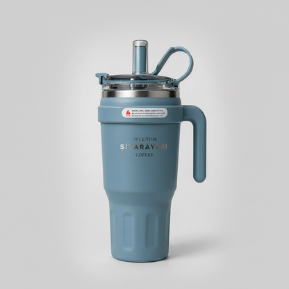 A dusty blue insulated travel tumbler with a matching handle, a clear lid with a blue straw, and the brand name 'SINARAYURI COFFEE' printed on the front, set against a light gray background.