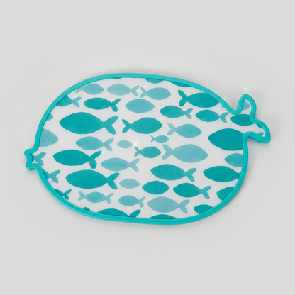 Fish-shaped teal cutting board on light gray background