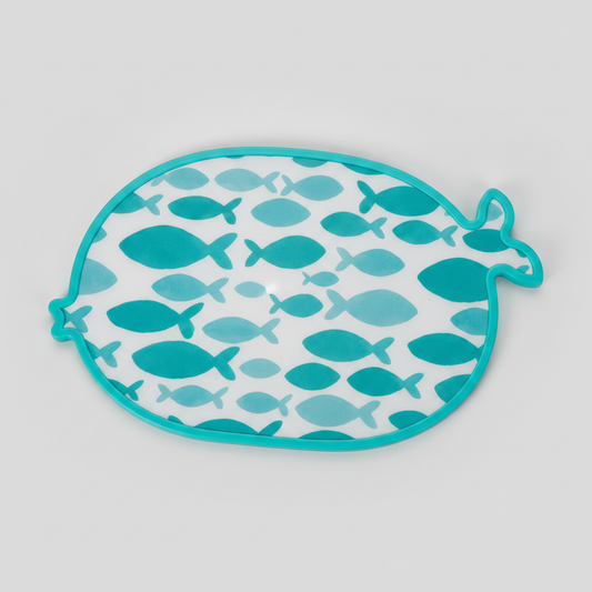 Fish-shaped teal cutting board on light gray background