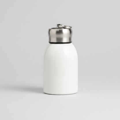 Mini stainless steel insulated bottle on light gray background